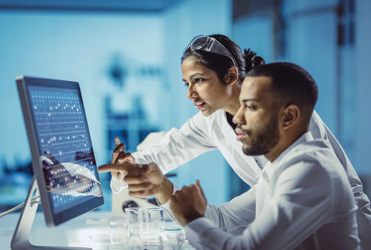 Scientists Studying Results In Their Lab